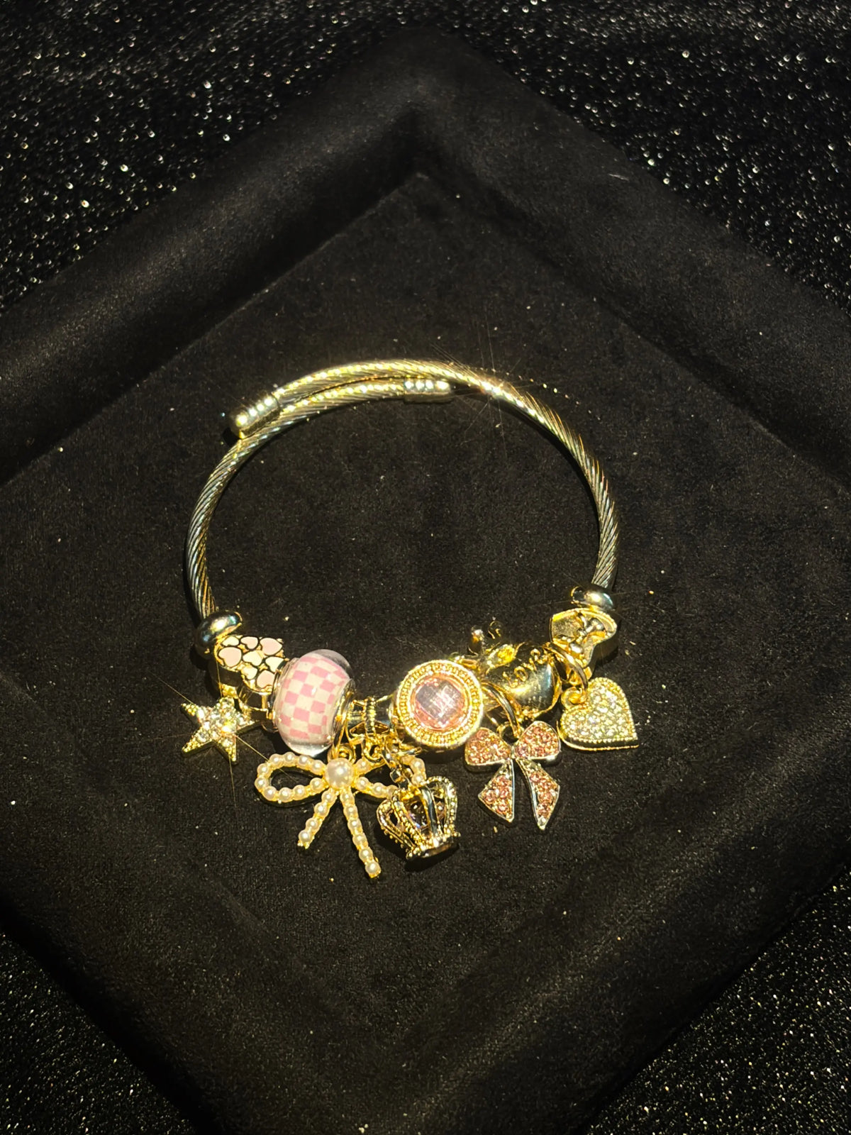 Women's Cute Princess-Style Gold-Tone Adjustable Cable Bangle with Pink Checkered Bead, Bow, Crown, and Heart Dangle Charms