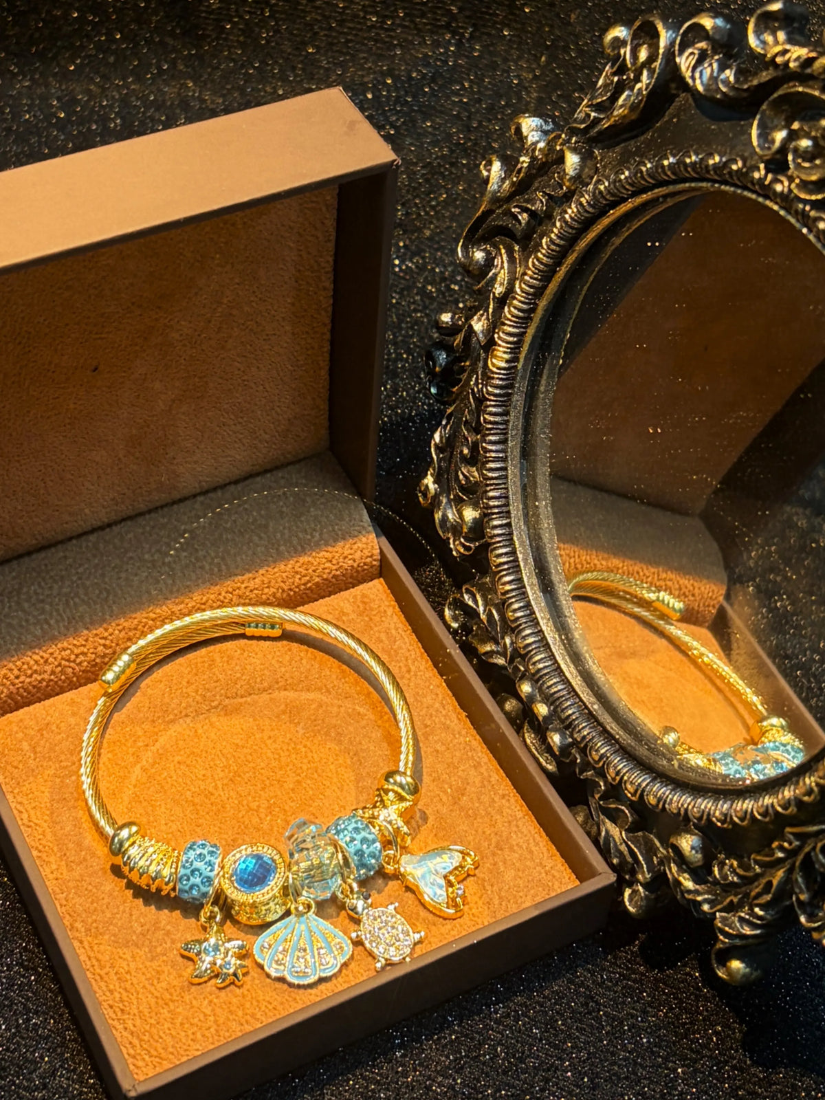 Women's Gold-Tone Ocean Theme Charm Bangle - Sea Shell, Turtle, Starfish, Mermaid Tail Accents with Sparkling Blue Crystal Beads