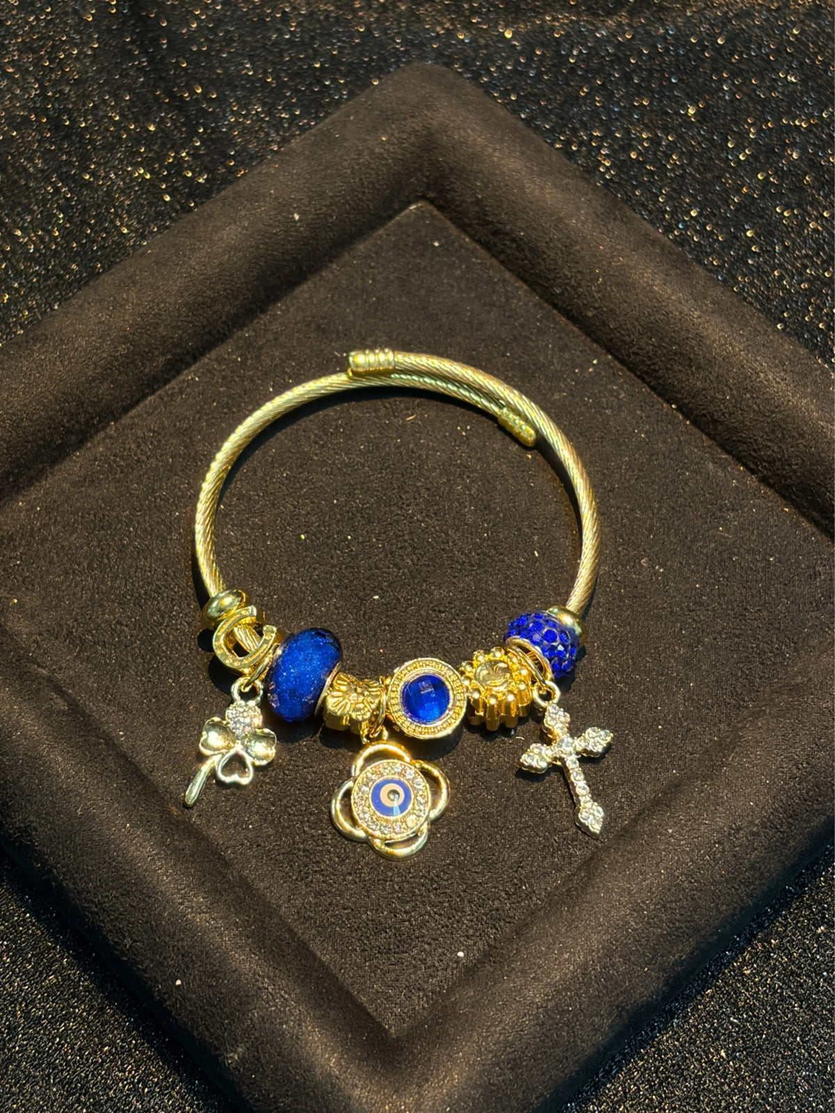 Women's Gold-Tone Open Cable Charm Bangle, Stackable Costume Jewelry Bracelet with Evil Eye, 4-Leaf Clover, Cross, Sparkling Blue Crystal Beads Charms
