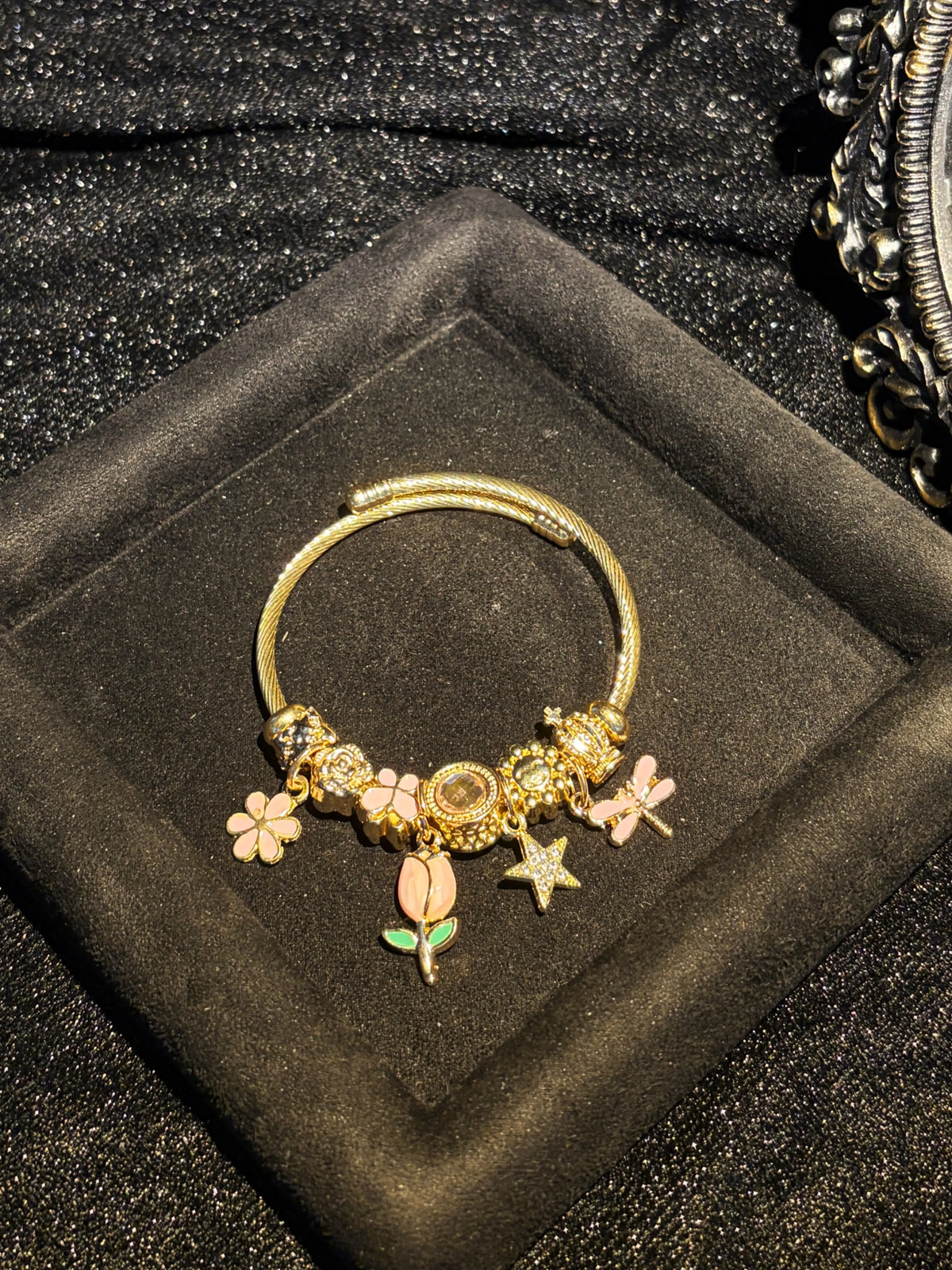 Women's Gold-Tone Open Bangle Bracelet with Pink Flower, Dragonfly, Star & Crown Charms, Stackable Costume Jewelry Gift