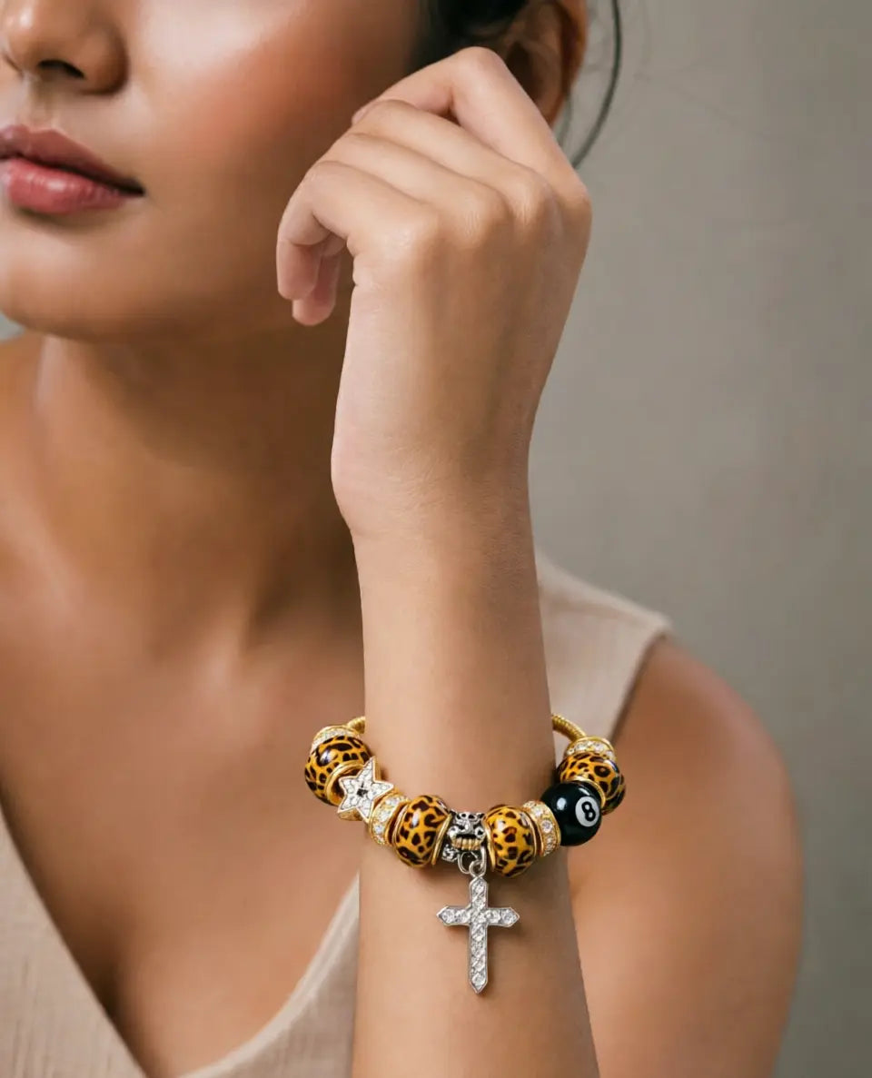 Wild & Holy Leopard Charm Bracelet: 8-Ball, Cross & Star Gold Snake Chain Bangle - Bold Statement Jewelry for Her