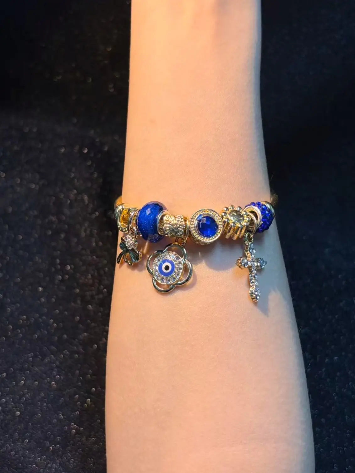 Women's Gold-Tone Open Cable Charm Bangle, Stackable Costume Jewelry Bracelet with Evil Eye, 4-Leaf Clover, Cross, Sparkling Blue Crystal Beads Charms