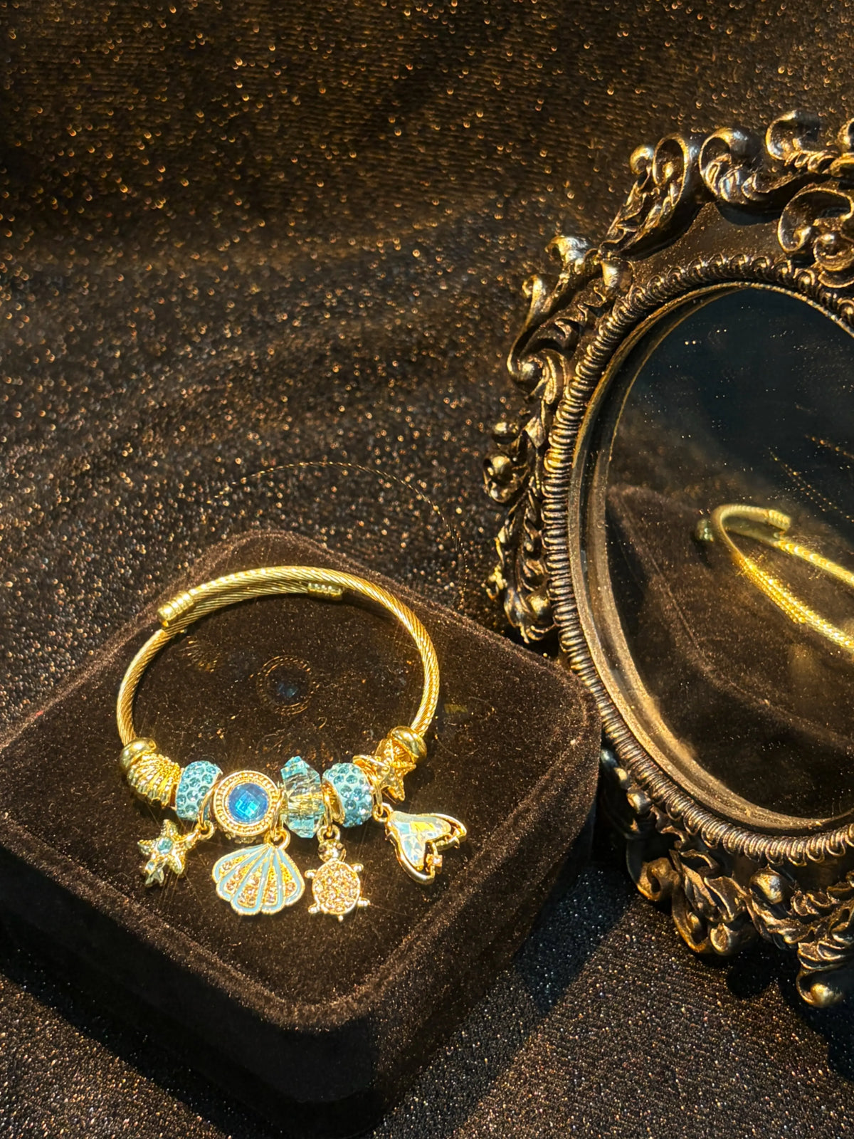 Women's Gold-Tone Ocean Theme Charm Bangle - Sea Shell, Turtle, Starfish, Mermaid Tail Accents with Sparkling Blue Crystal Beads