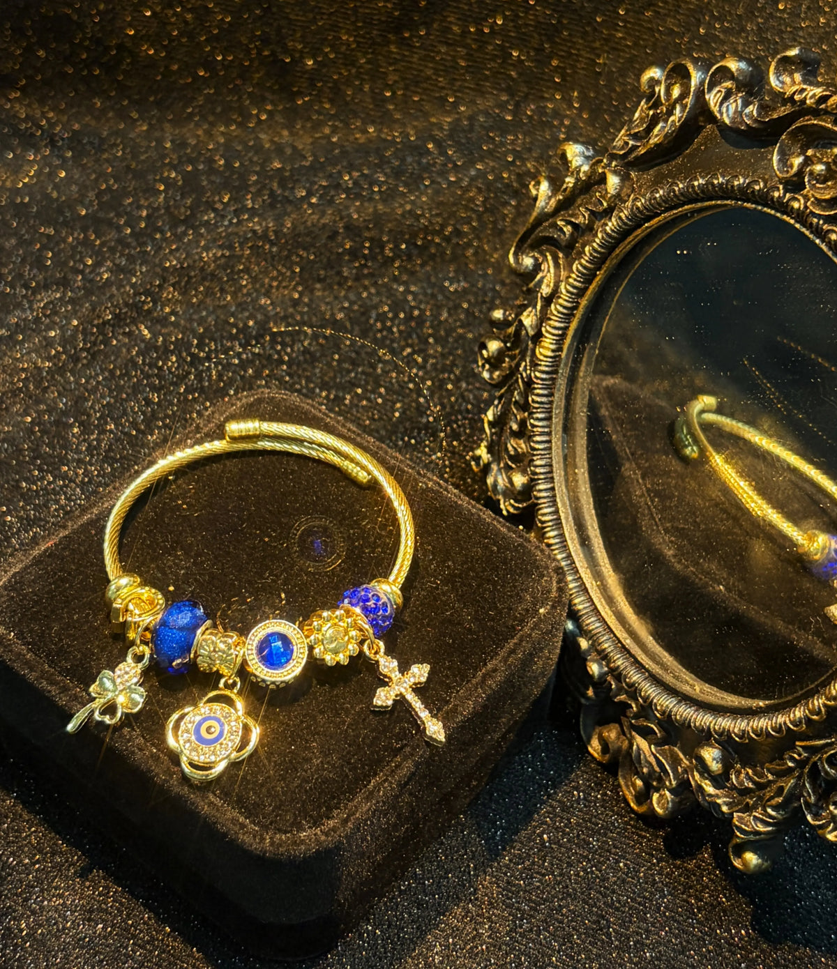 Women's Gold-Tone Open Cable Charm Bangle, Stackable Costume Jewelry Bracelet with Evil Eye, 4-Leaf Clover, Cross, Sparkling Blue Crystal Beads Charms